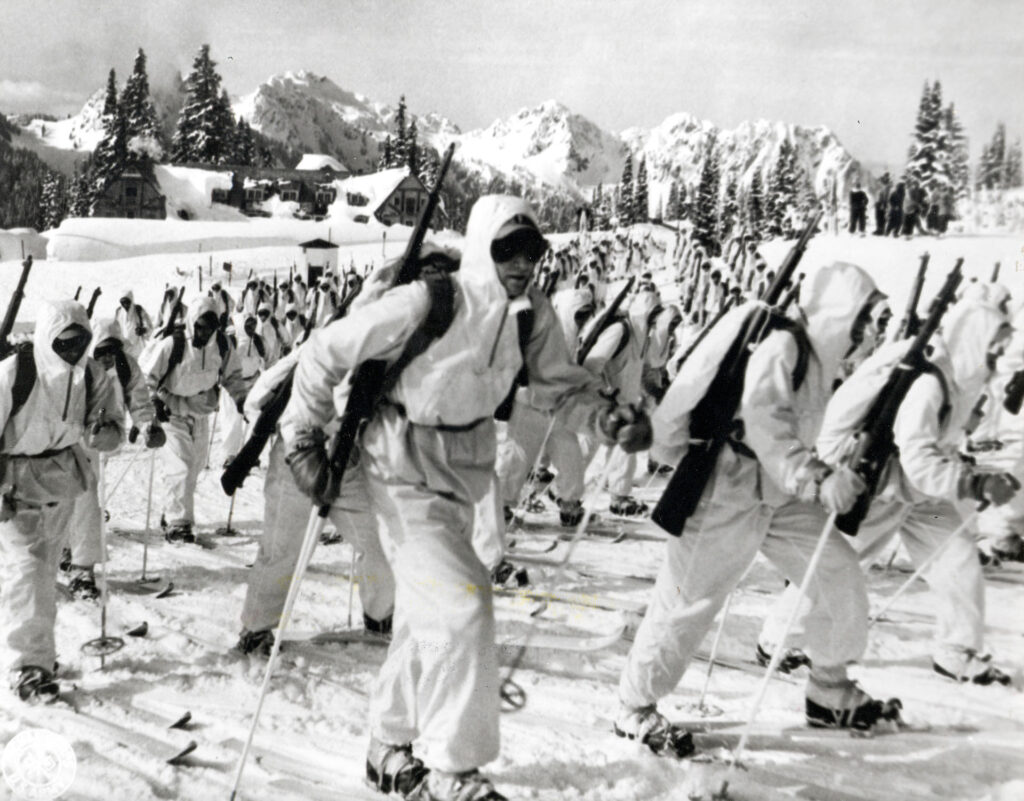 Historic black and white photo of 10th mountain division members