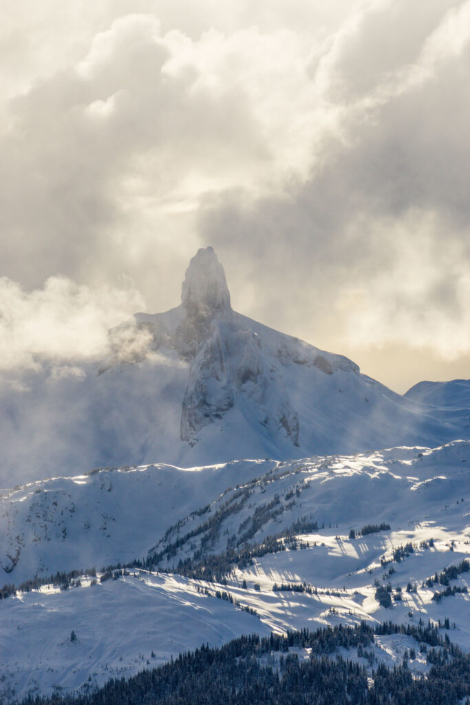 Image of the black tusk at Whistler Blackcomb with misty clouds all around 
