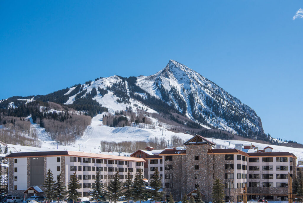 Mount Crested Butte in the background with lodging and condo location in the foreground