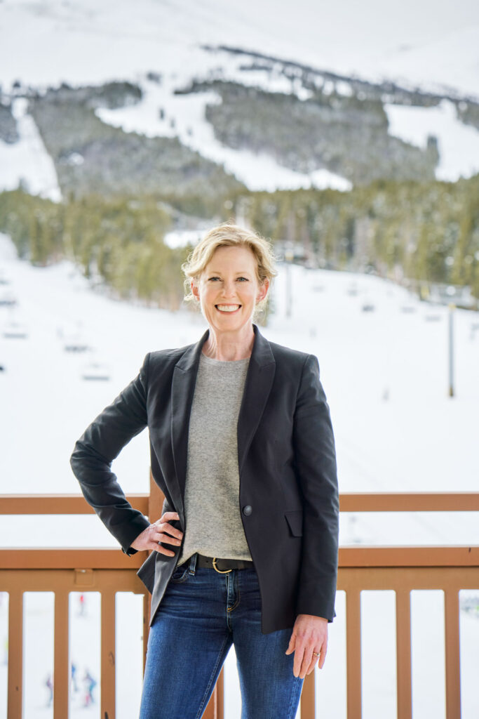 Headshot of Kirsten Lynch with breckenridge mountain in the background