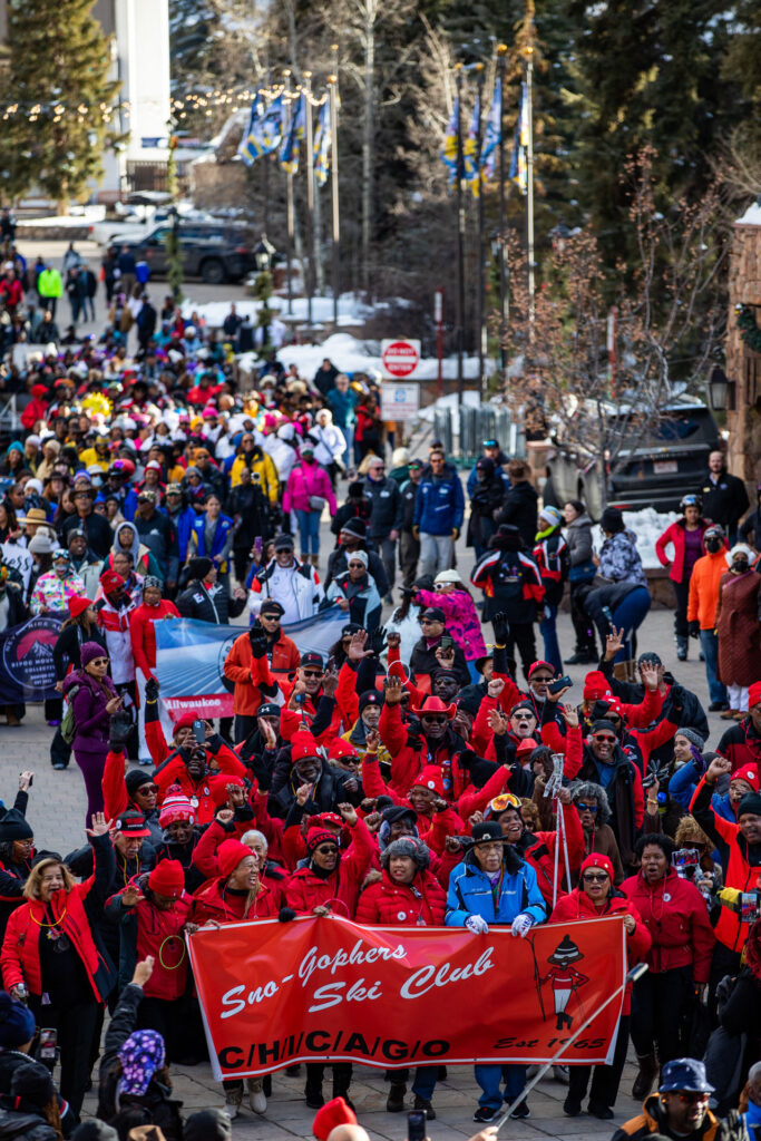 Large group of people holder banners and marching through town