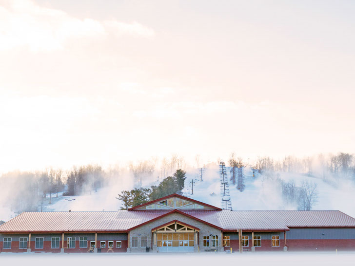 Base area view of the lodge and 2 lifts at mad river