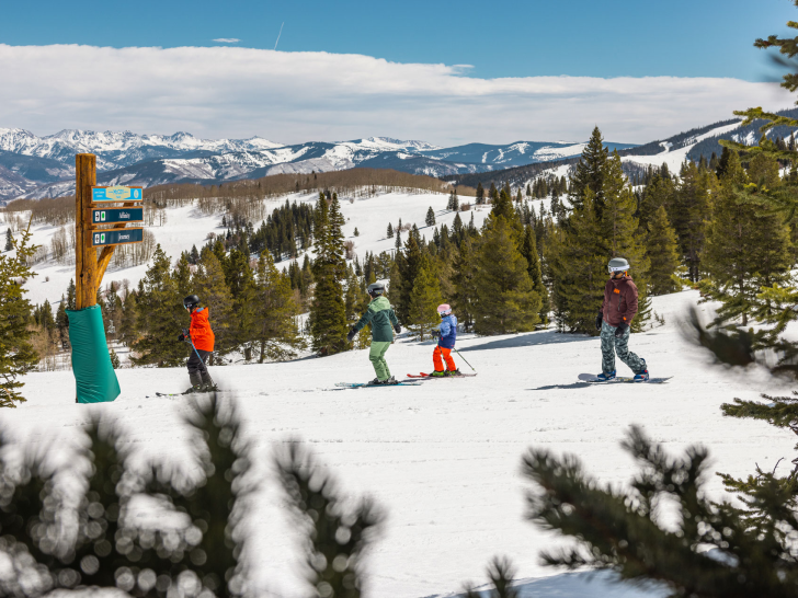 Image of a family skiing in mccoy park in beaver creek on sunny day
