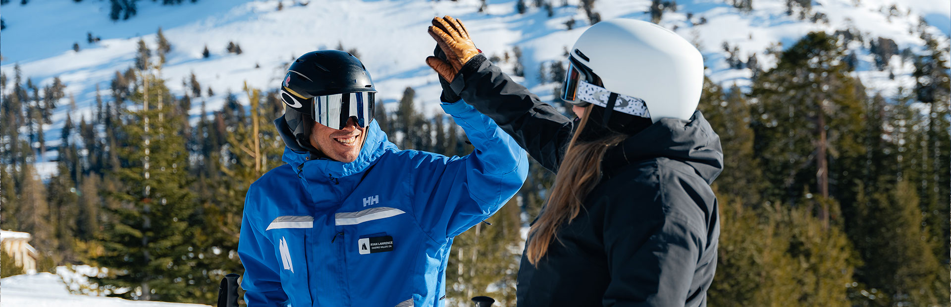 Ski instructor giving a skier a high five