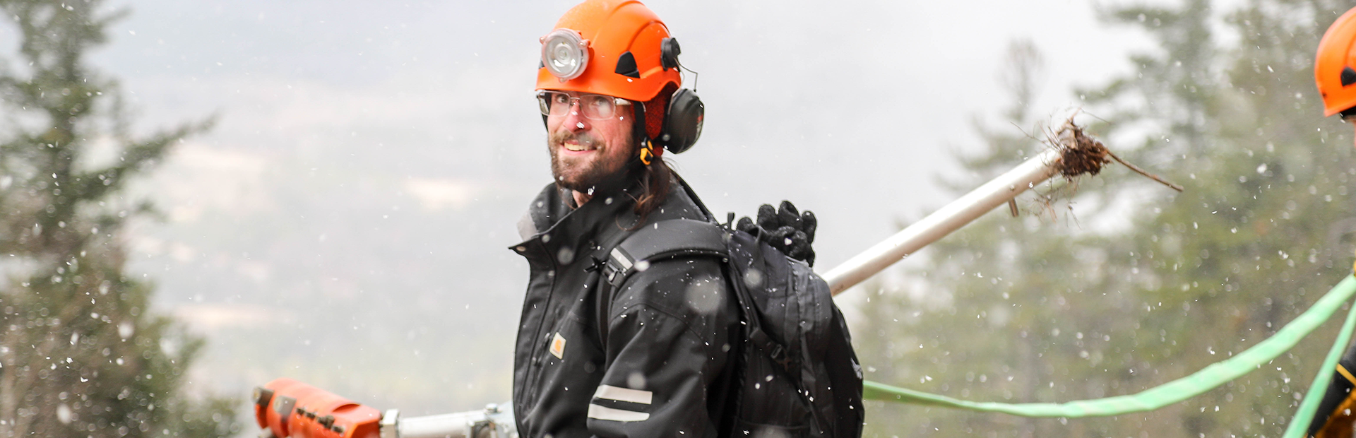 Mountain operations team member working on snowmaking equipment