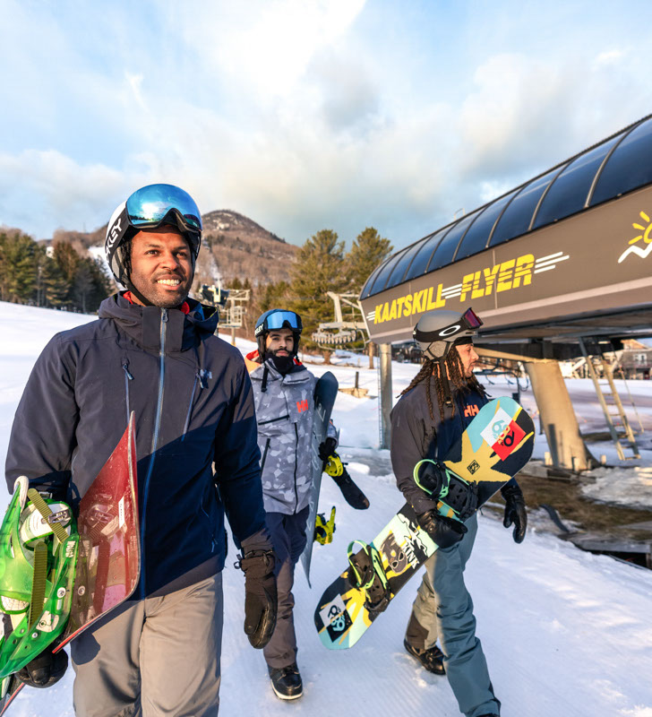 Three friends getting ready to load the Kaatskill flyer lift at hunter