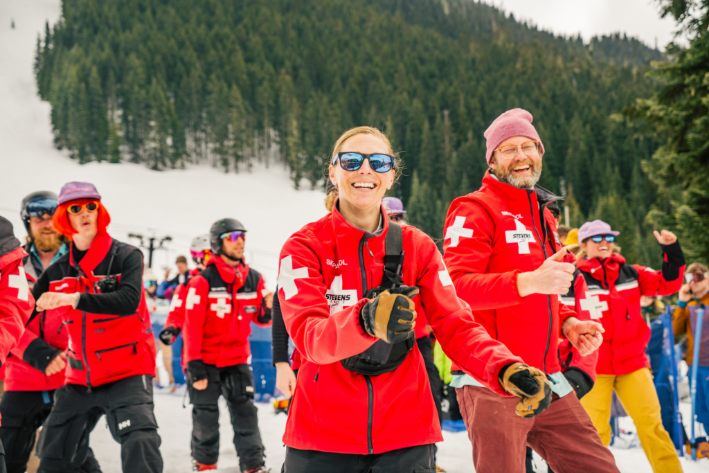 A group of ski patrol employees smiling at Spring Fest