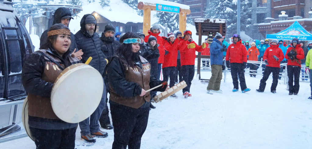Members of the First Nations blessing the new gondola with Whistler Blackcomb employees looking on