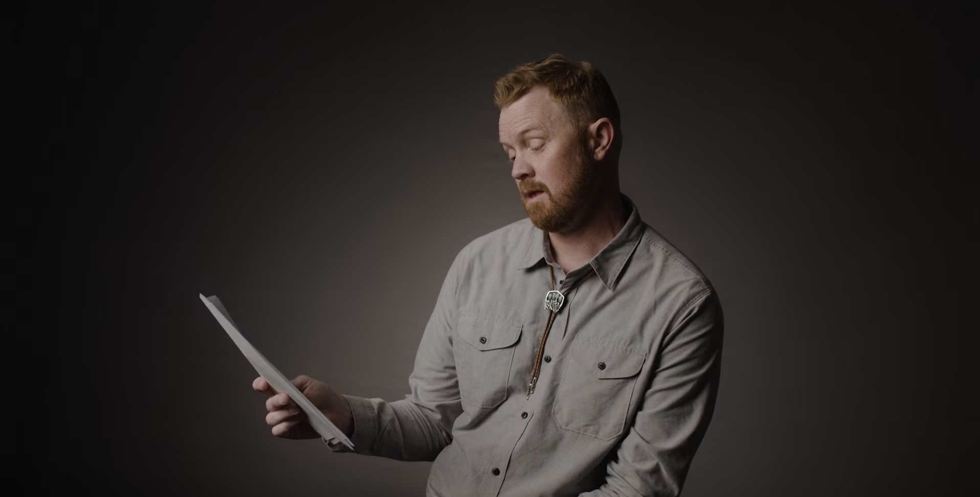 Man reading a letter 